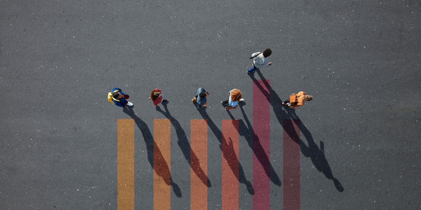 Income-contingent loans: Students walk through a cloistered square.