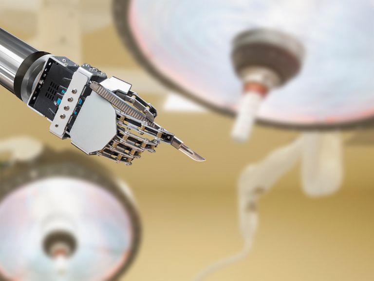 Artificial intelligence and the law: Robotic hand holds a scalpel.