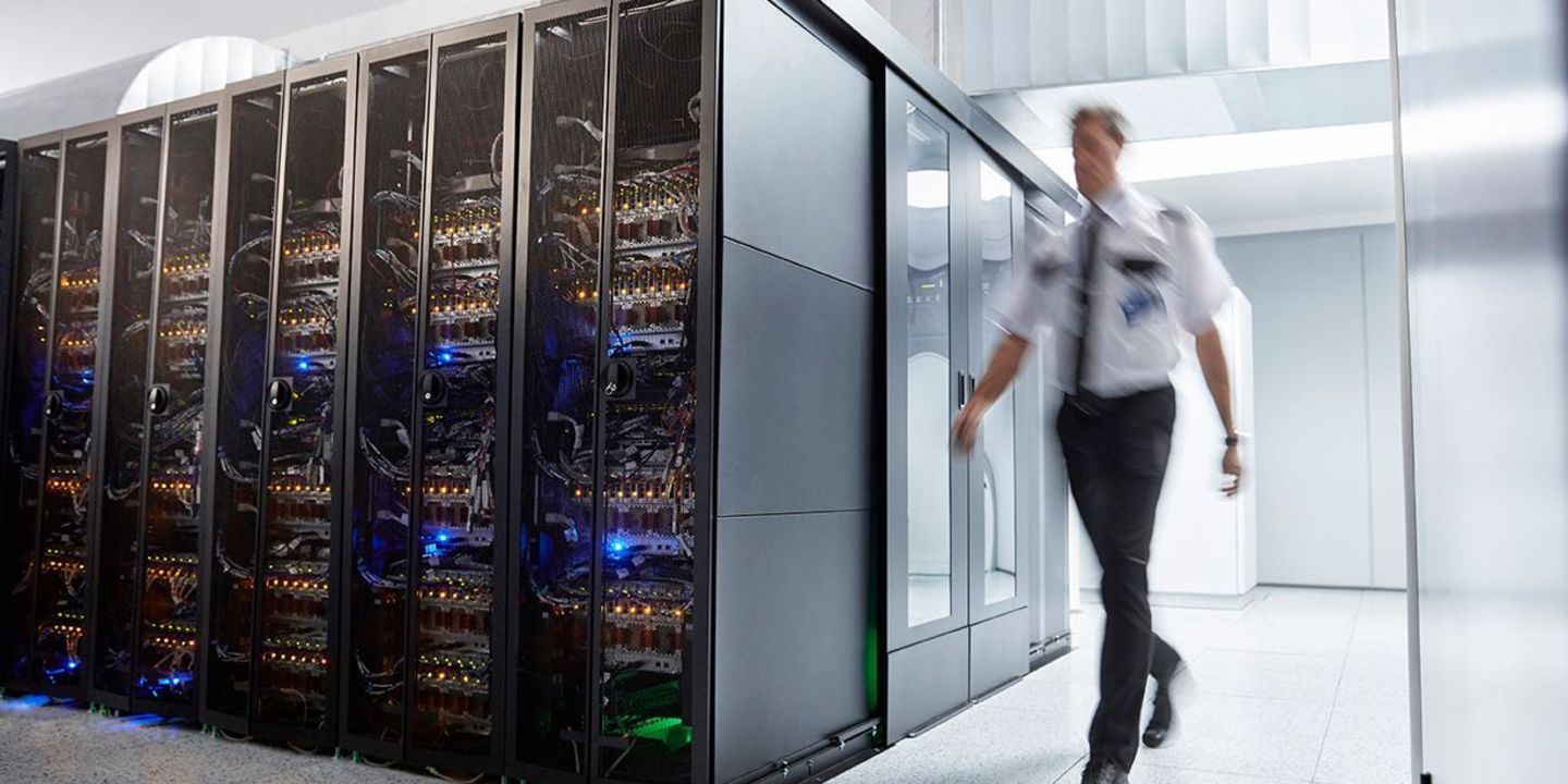 Cyber security: A security guard checks the server room